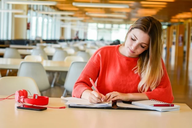 Young student studying in university library