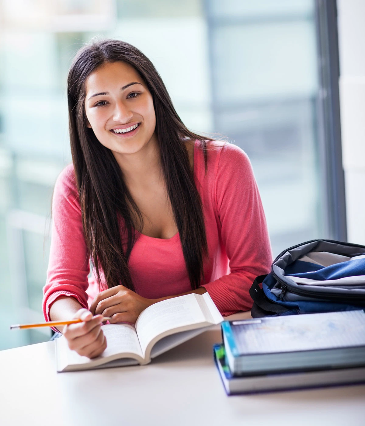 Confident college student smiling on campus