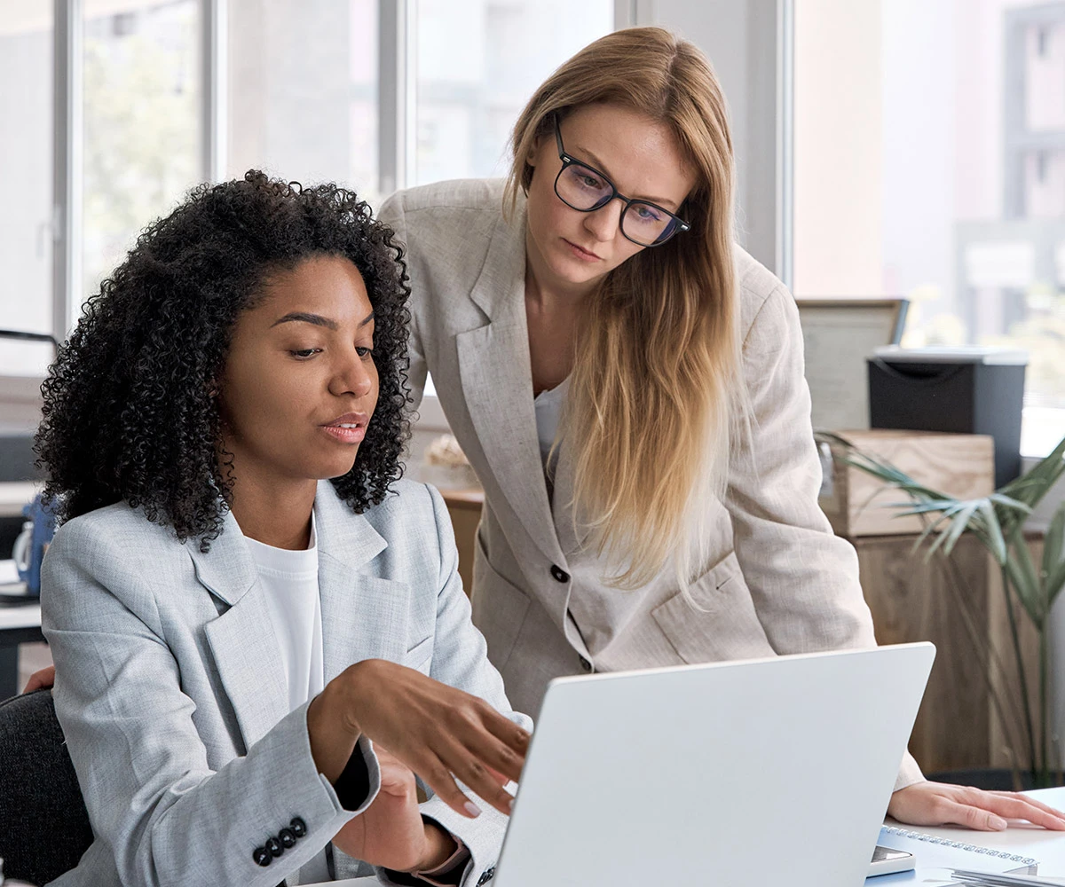 Female executives collaborating in meeting room