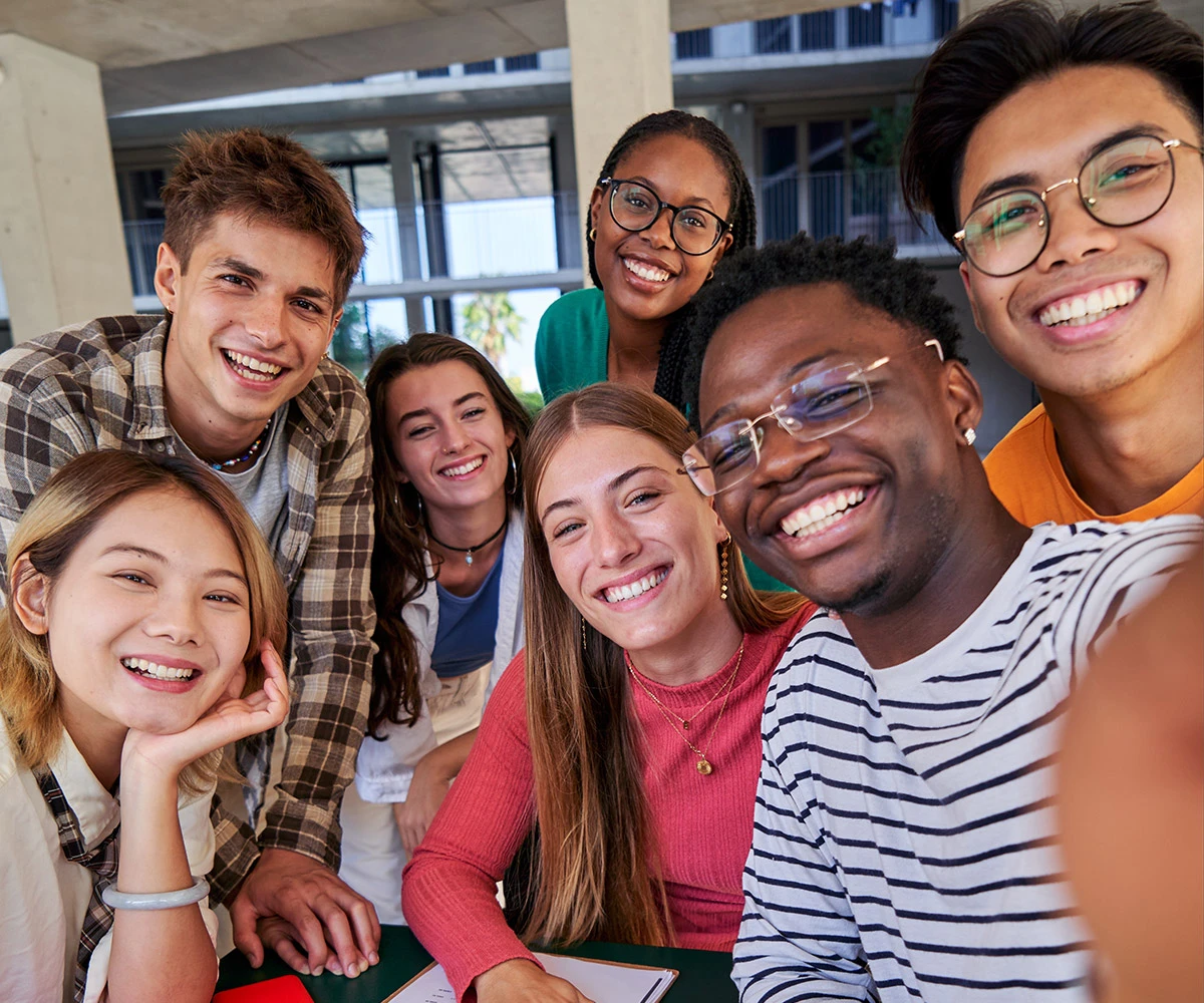 Group of college students socializing on campus