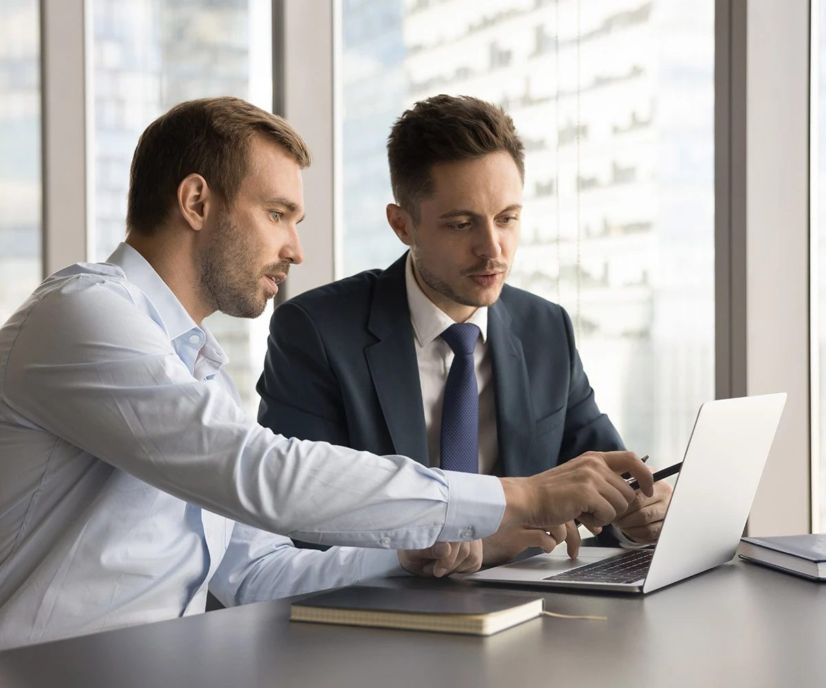 Businessmen discussing ideas during office meeting