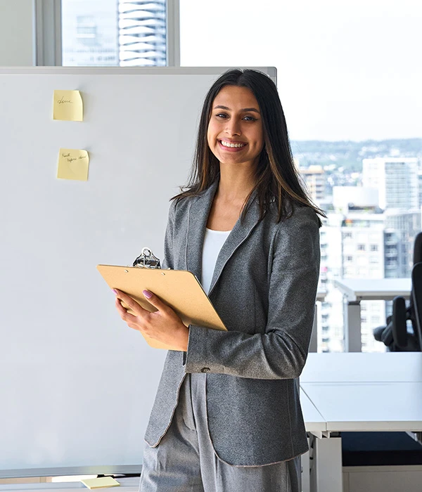 Confident professional woman smiling in workplace