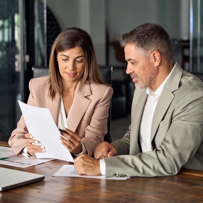 Male and female professionals working together in office