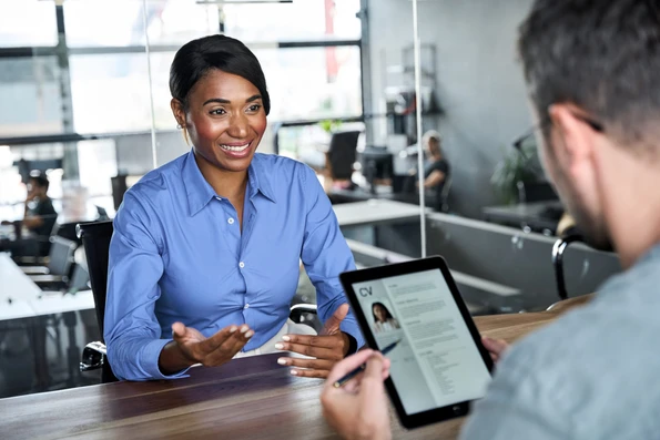 African,American,Young,Woman,Job,Seeker,Talking,To,Professional,Male